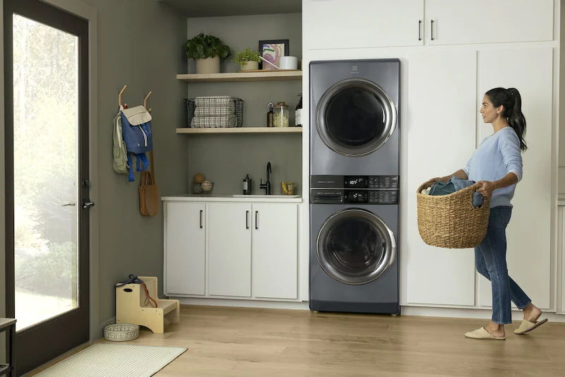 stackable washer dryer in laundry room full