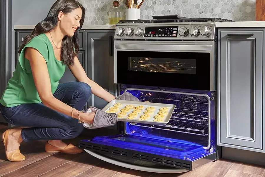 woman cooking in lg oven