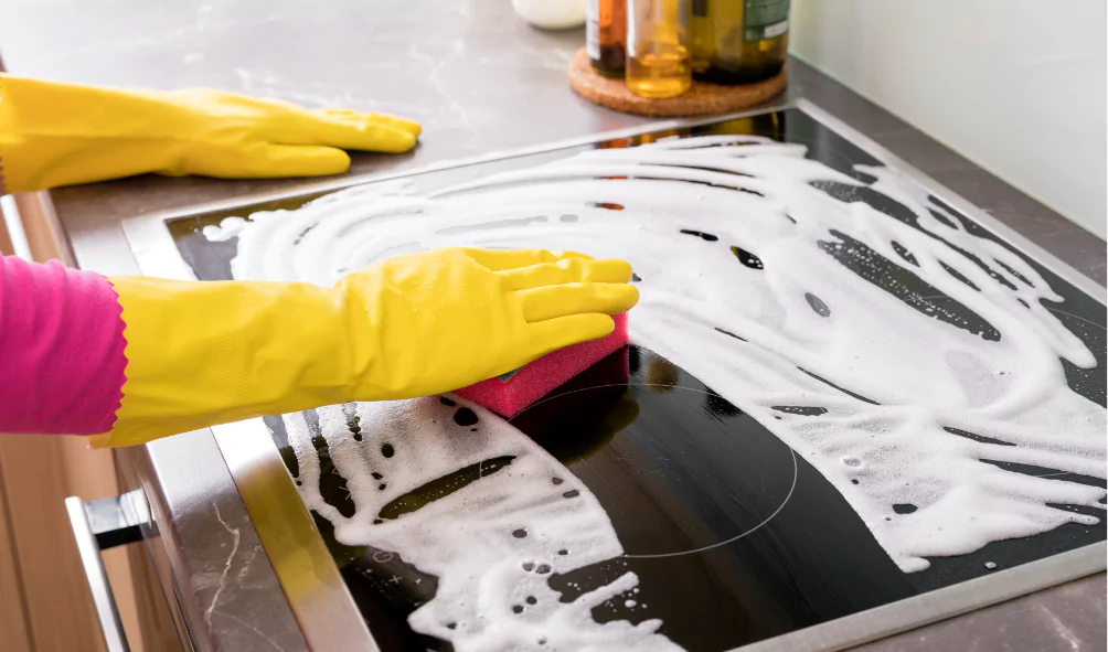 glass stove top cleaning with gloves