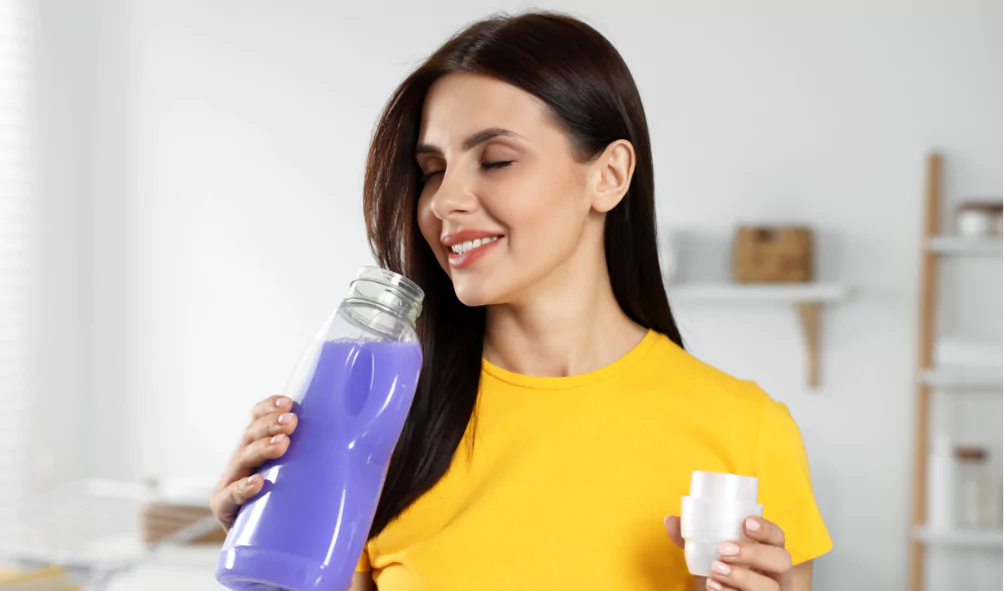 woman smelling fabric softener