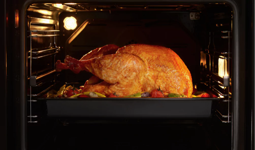 turkey being cooked in stove oven